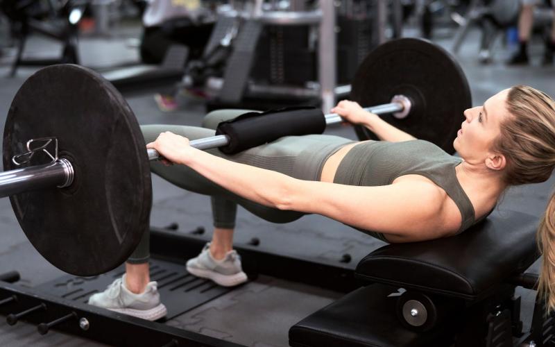 A lifter setting up a hip thrust