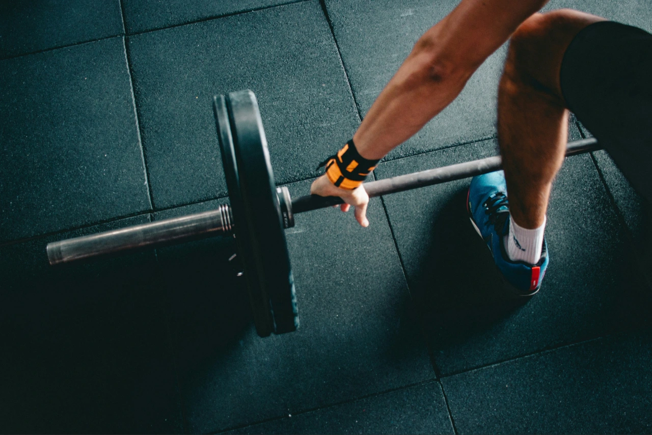 A loaded barbell and weight plates